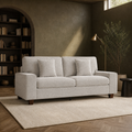 Room | Beige-gray chenille compact sofa in an olive library room with brick arch and reading lamp