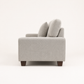 Studio | Right-side profile of the compact sofa showing arm depth, straight back, and brown wood legs