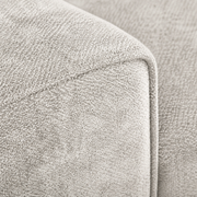 Detail | Close view of beige-gray nubby chenille upholstery and a cushion-edge seam