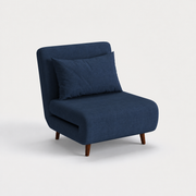 Studio three-quarter | navy blue plain-weave convertible chair turned to show its deep seat, folding seam, and espresso pine legs