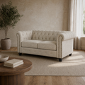 Room | Front-right three-quarter view of the beige linen blend Chesterfield loveseat in the warm sand living room