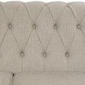 Detail | Close view of the beige linen-blend cross-hatch weave and diamond-button tufted back