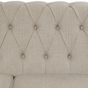 Detail | Close view of the beige linen-blend cross-hatch weave and diamond-button tufted back