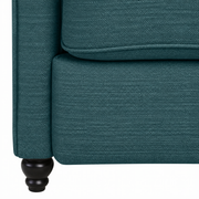 Fabric detail | Close view of the Caribbean Blue woven upholstery, seat edge, lower apron, and turned foot