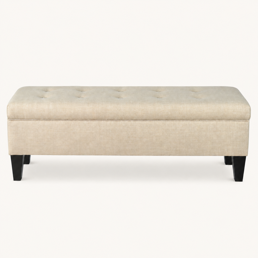 Studio front | Beige rectangular storage bench with button-tufted lid and four dark tapered legs