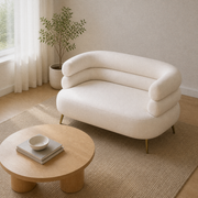 Angle | three-quarter view of a cream-beige velvet loveseat in a pale oak living room