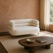 In a room | cream-beige velvet loveseat in a terracotta plaster living room with a dark walnut table
