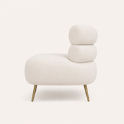 Side | right-side studio view of a cream-beige velvet loveseat showing rounded roll ends and gold legs