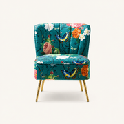 Front | teal-blue floral velvet armless slipper chair on a clean studio ground with channel-tufted back and gold legs