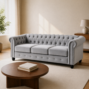 Room | Front-right three-quarter view of the light gray velvet Chesterfield sofa in the cream living room