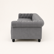 Studio | Right-side rear profile showing the rolled arm, side nailhead trim, back, and black turned legs