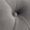 Texture | Extreme close-up of the light gray velvet tuft, fabric-covered button, and stitched diamond seams