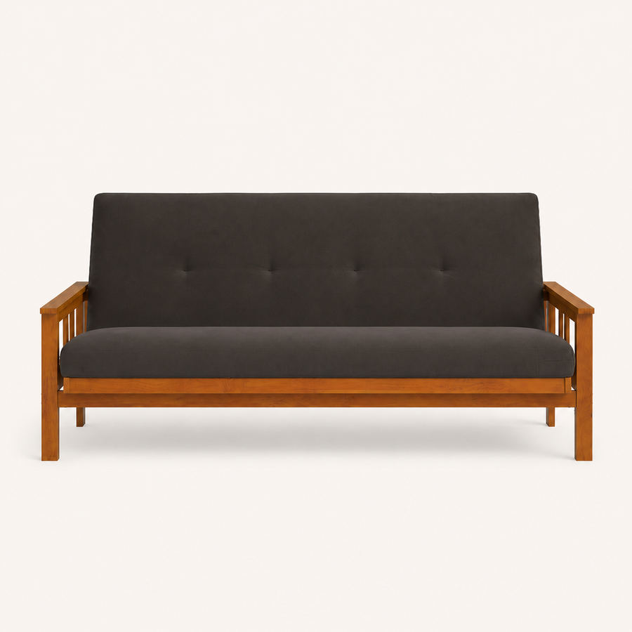 Front | Straight studio view of the charcoal-gray futon, with its button-tufted back, low wood rail, and both slatted arms