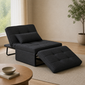 Angle | opposite three-quarter living-room view of the dark charcoal convertible chaise with matching ottoman cushion and bolster pillow