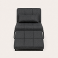 Front | front studio view of the dark charcoal convertible chaise reclined with its matching ottoman cushion and bolster pillow