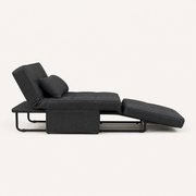 Side | side studio view of the dark charcoal convertible chaise with its black bent-metal support frame visible