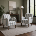 In a room | two blue-and-ivory striped armchairs in a sage living room with walnut flooring
