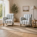 Second warm farmhouse room angle showing both matching striped armchairs