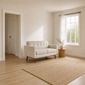 Scale | Beige linen loveseat beside a full doorway and window in a compact room