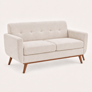 Studio | Three-quarter view of the beige linen loveseat with square arms and wood base