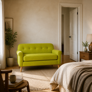 In scale | vivid lime-green tufted loveseat beside a fully visible interior doorway