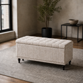 City loft | warm beige upholstered storage ottoman with a tufted lid, channel stitching and silver nailhead trim