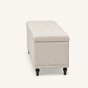 Studio side | warm beige patterned storage ottoman right-side profile showing its 16.73 inch depth and dark turned legs