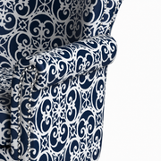 Detail | close view of the rolled arm edge and curved rows of bright silver nailheads