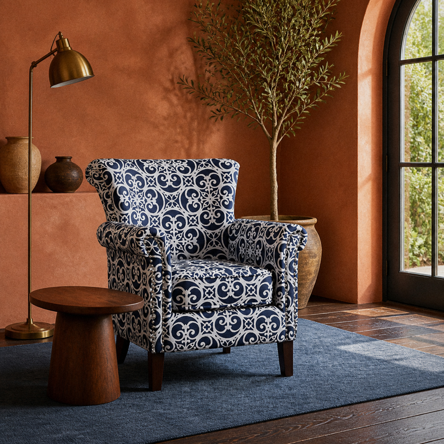 In a room | patterned club chair in a warm terracotta garden room with an arched door and indigo rug