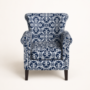 Front | straight-on studio view of the patterned club chair, rolled arms, silver nailheads, and dark wood legs