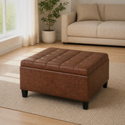 Room | three-quarter view of closed umber-brown faux leather ottoman on a plain oatmeal rug in a bright living room