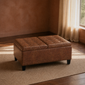 Room | closed umber-brown faux leather ottoman on a plain oatmeal rug in a terracotta-walled living room