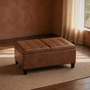 Room | closed umber-brown faux leather ottoman on a plain oatmeal rug in a terracotta-walled living room