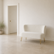 Scale | ivory velvet channel-tufted armless loveseat beside a full-height interior doorway for scale