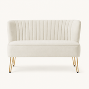 Front | straight-on studio view of the ivory velvet channel-tufted armless loveseat with four gold hairpin legs
