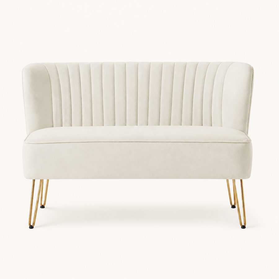 Front | straight-on studio view of the ivory velvet channel-tufted armless loveseat with four gold hairpin legs