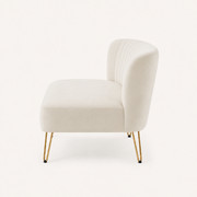 Side | right-side studio profile of the ivory velvet channel-tufted armless loveseat with gold hairpin legs