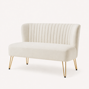 Studio | front-right studio view of the ivory velvet channel-tufted armless loveseat with gold hairpin legs