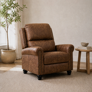 Warm white room | brown faux-leather recliner upright from a second three-quarter angle beside a pale oak side table