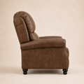 Studio side | brown faux-leather recliner side profile showing the rounded back, arm depth, side panel, and black bun feet