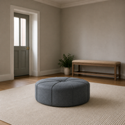Scale | ottoman in an entry sitting room with a full-height doorway showing scale