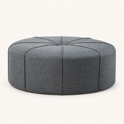 Front | front studio view of the slate gray-blue eight-panel corded ottoman