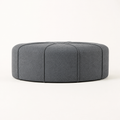 Side | low studio side profile showing the ottoman's corded vertical panels