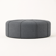 Side | low studio side profile showing the ottoman's corded vertical panels