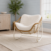 Coastal blue-gray room | white metal rocking chair with wicker rim and cream boucle cushion