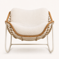 Studio front | white metal rocking chair with honey wicker rim, rope lacing, and curved runners