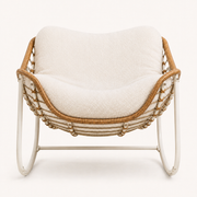 Studio front | white metal rocking chair with honey wicker rim, rope lacing, and curved runners