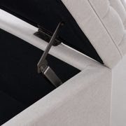 Hardware close-up | dark metal hinge and flip-top support beside the black-lined storage cavity and light gray tufted lid