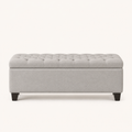 Front | light gray polyester storage ottoman in a clean studio front view, diamond tufting on the flip top, plain body, and four tapered dark wood legs