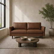 Living room | Mid-brown faux leather sofa in a stone-toned open-plan room